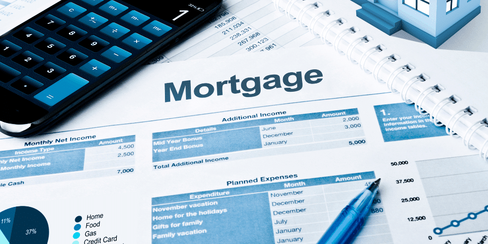 The concept of mortgage interest rates represented by mortgage paperwork and a calculator